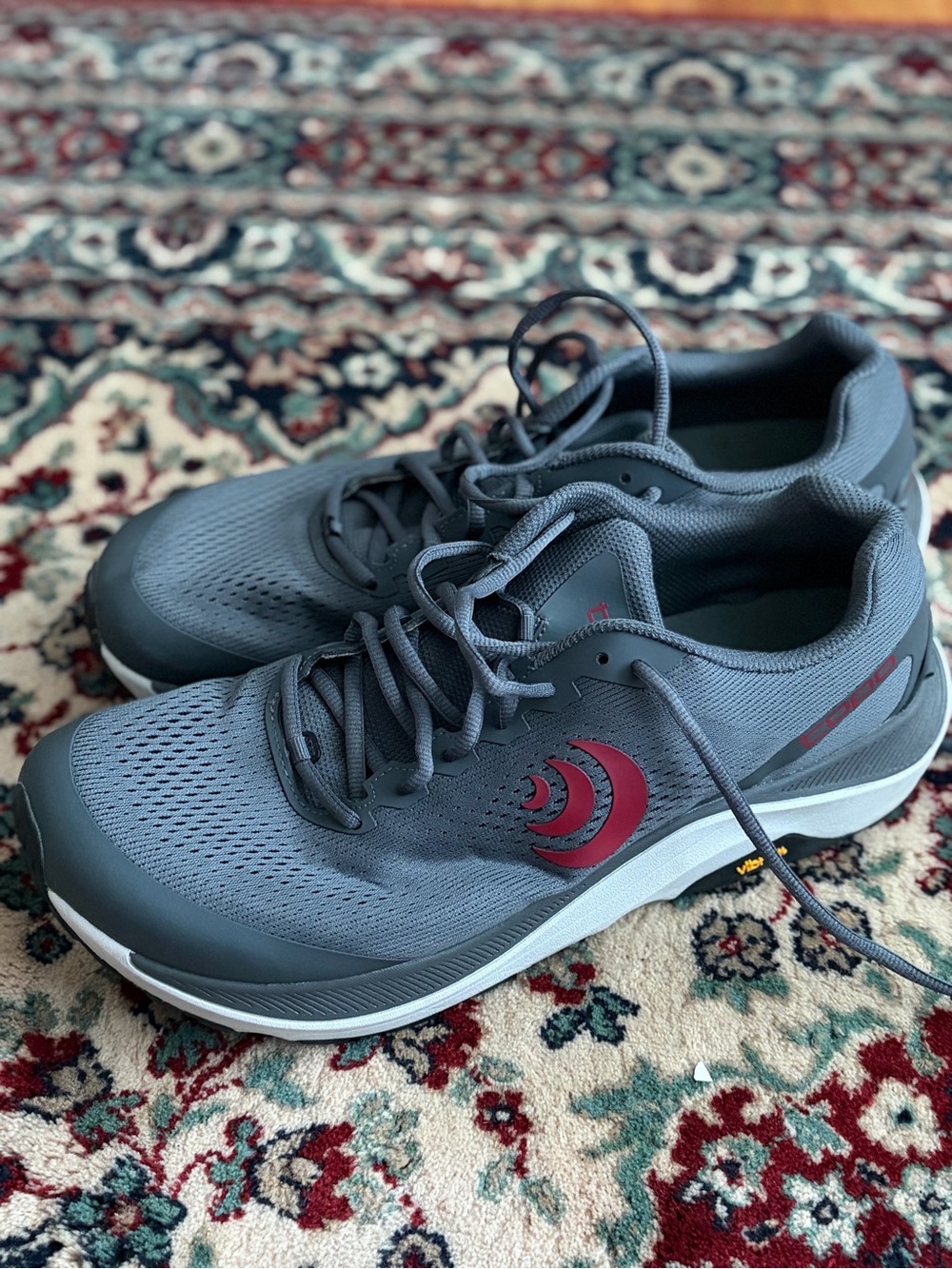 the Topo Athletic Ultraventure 3 in the Grey/Red colorway, size 13